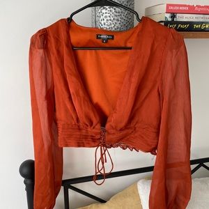 Long sleeve burnt orange crop top